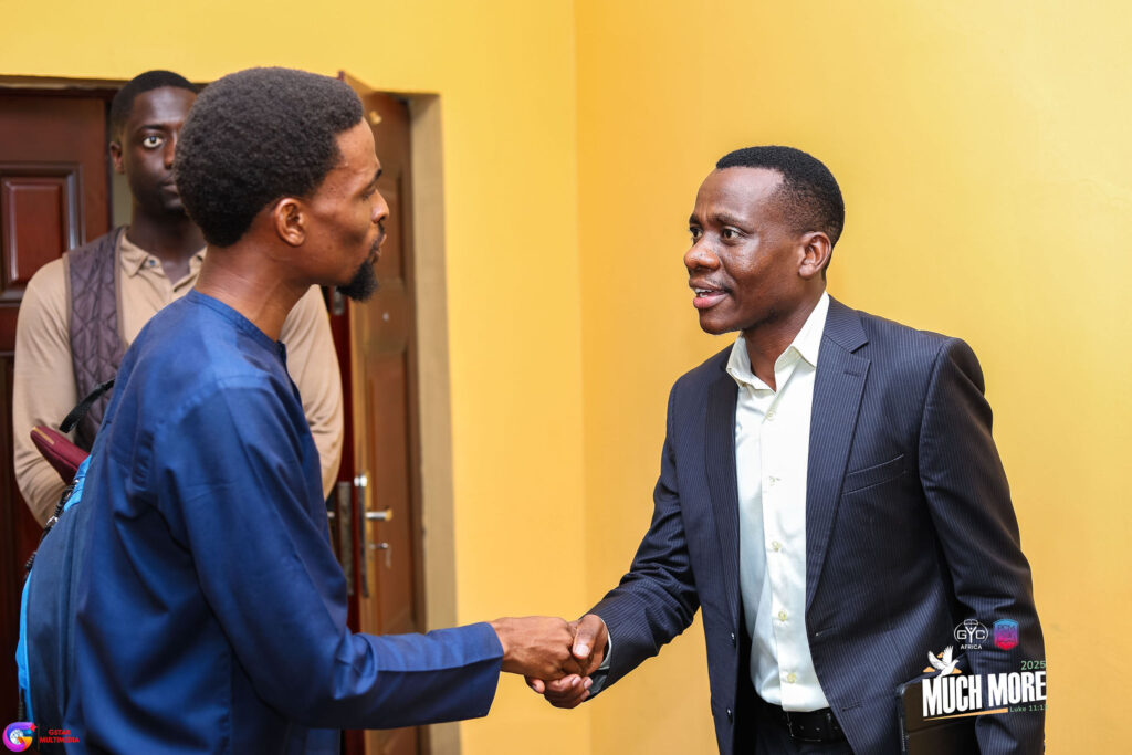 Two men shaking hands at the conference
