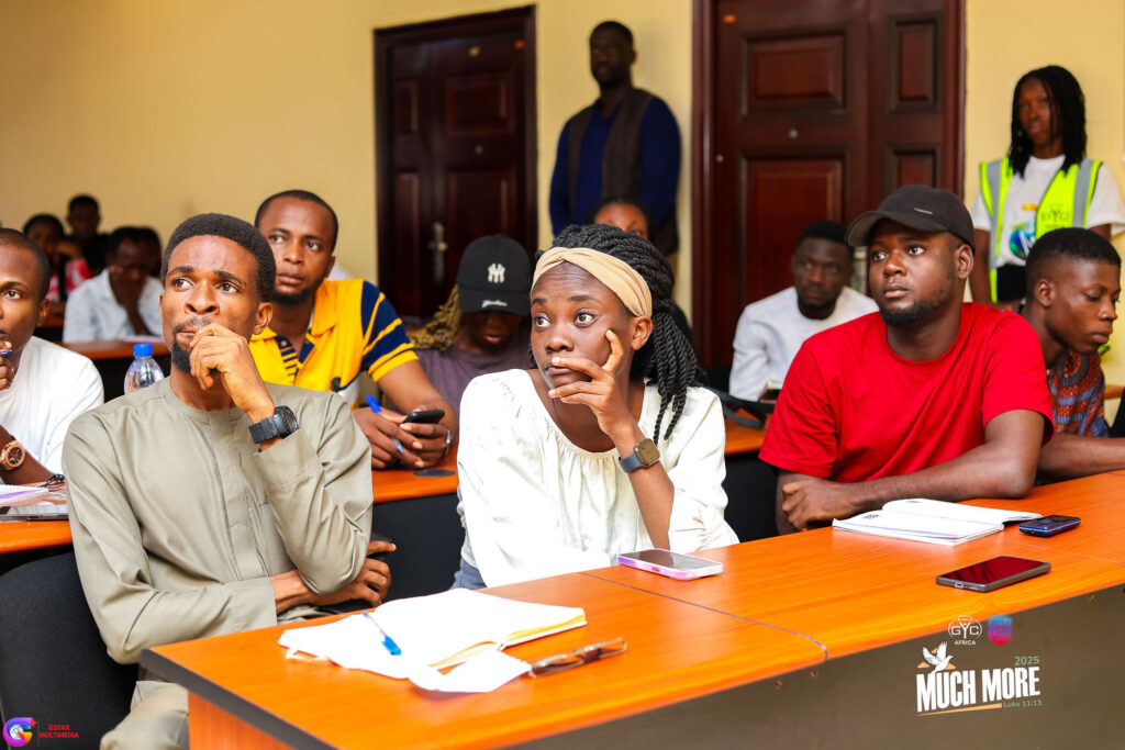 Young people taking notes in a workshop
