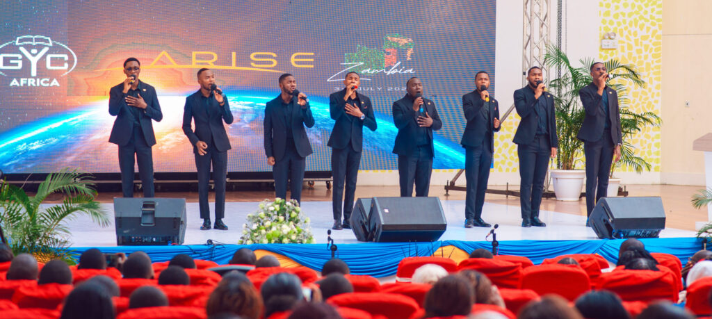 A male vocal group singing on the ARISE stage