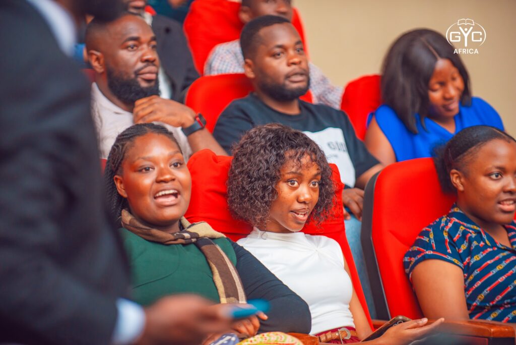 Delegates smiling during a Sabbath session