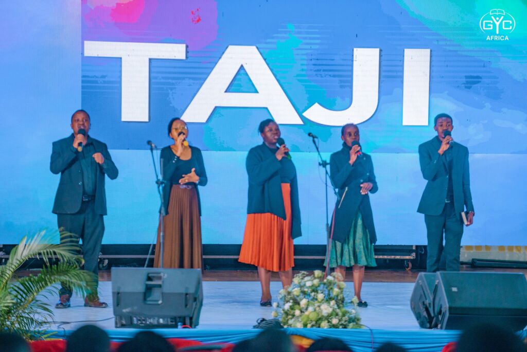 A vocal group sings on stage during Sunday worship