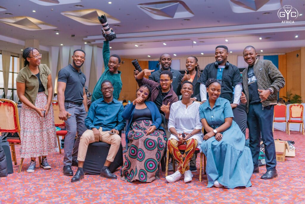 Delegates gather for a joyful group photo on Monday